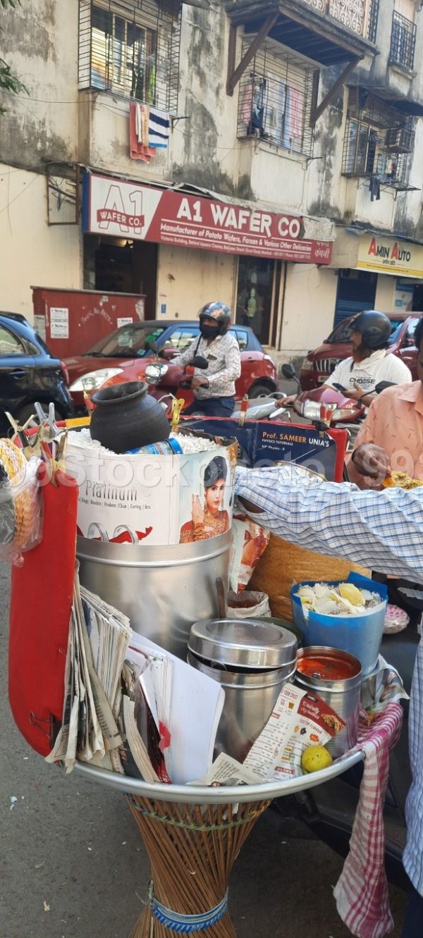 Vendor selling bhelpuri snacks near A1 Wafer Co.