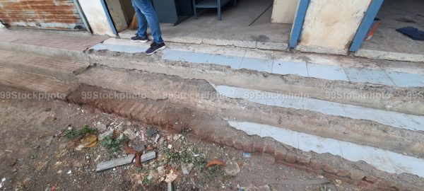 Stock Photo of Broken pavement and steps with dirt