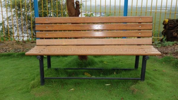 Stock Photo of Empty Sitting Bench in Garden