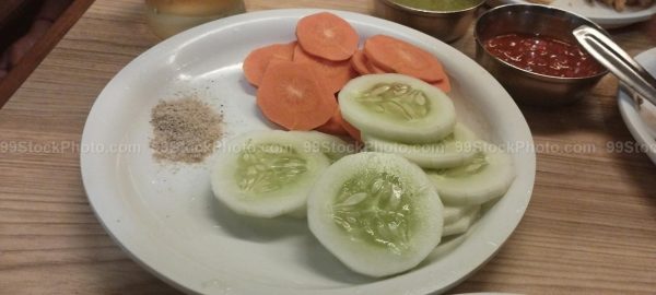 Stock Photo of Indian sides Cucumber Salt and Carrot