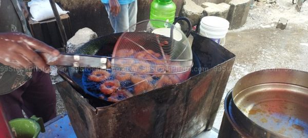 Stock Photo of Hawker Mendu Wada cooking Roadside Type 2