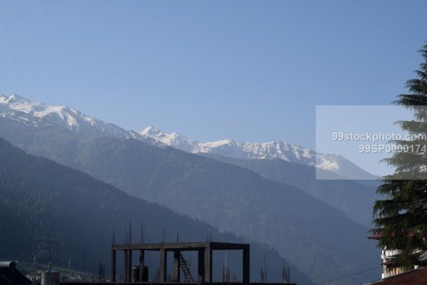 Stock Photo of Snow Clad Mountains with a distant view