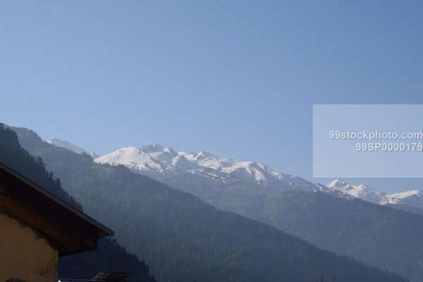 Stock Photo of Snow Clad Mountain in Summer View in Manali