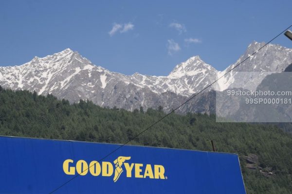 Stock Photo of Goodyear Logo with Snow Clad Mountains in Background