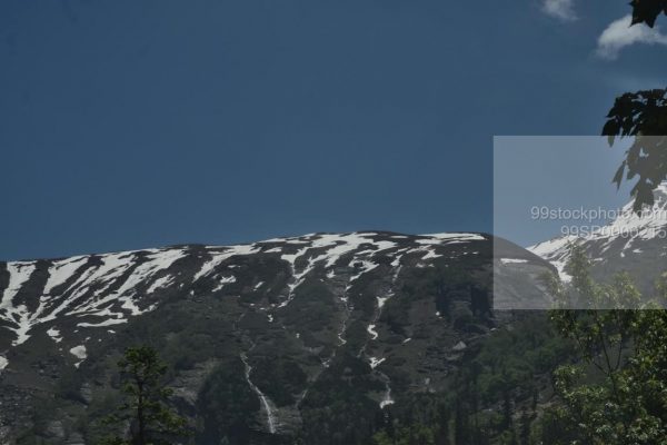 Stock Photo of Blue Sky Snow Mountains Manali