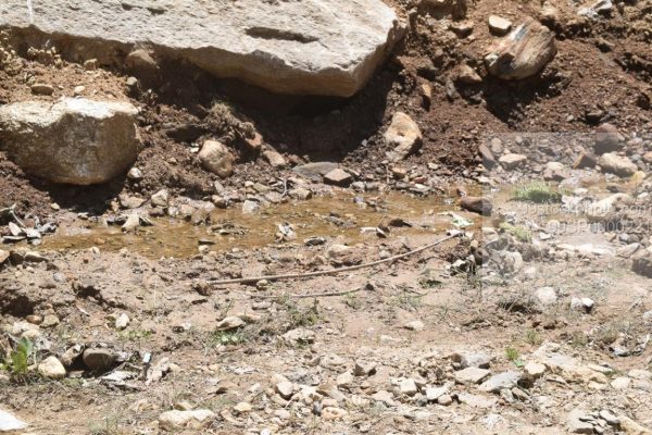 Stock Photo of Rock Mud Water Stream