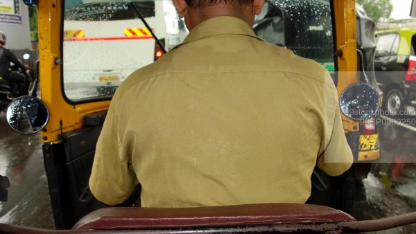 Stock Photo of Autorickshaw in Monsoon with Driver in Mumbai