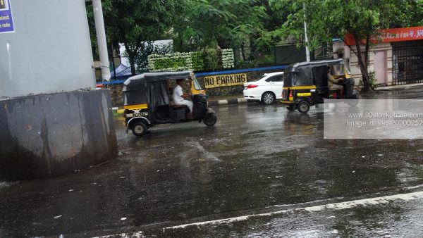 Stock Photo of Ricshaw in Mumbai in Rains with No Parking Signage