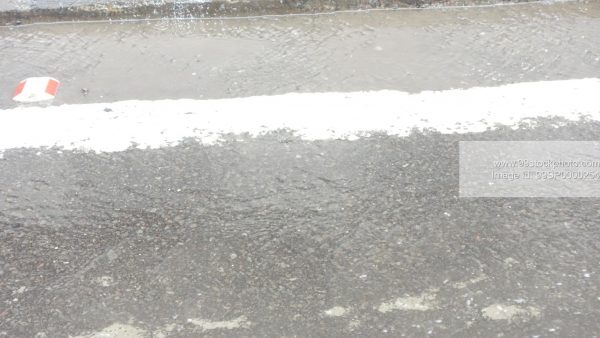 Stock Photo of Wet Tar Road in Mumbai Rains Type 1