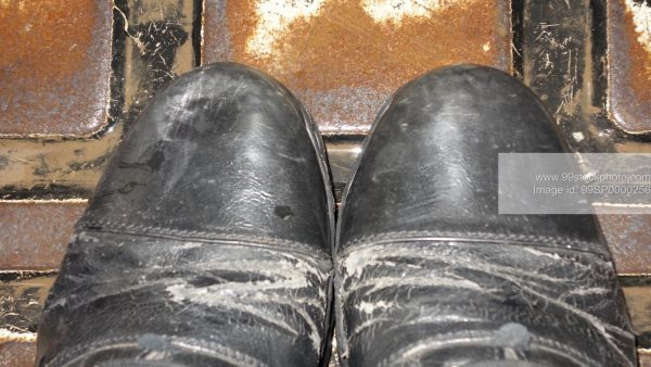 Stock Photo of Wornout Office Shoes in Mumbai Rickshaw