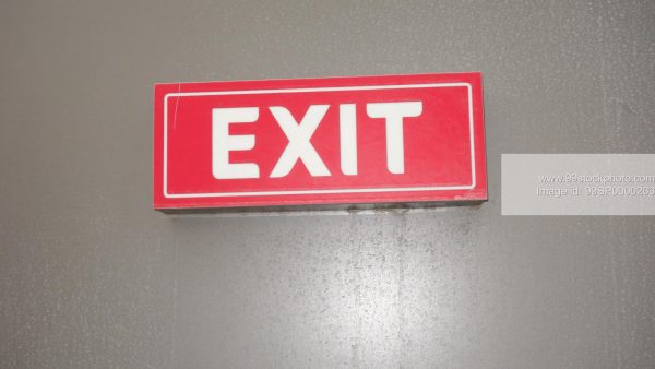 Stock Photo of Red and White Exit Signage on a Wall