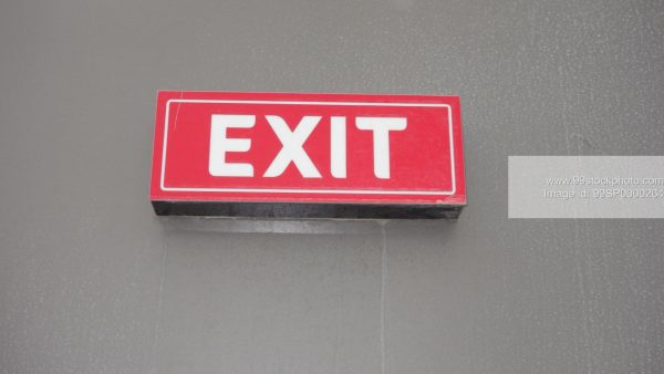 Stock Photo of Red and White Exit Signage on a Wall