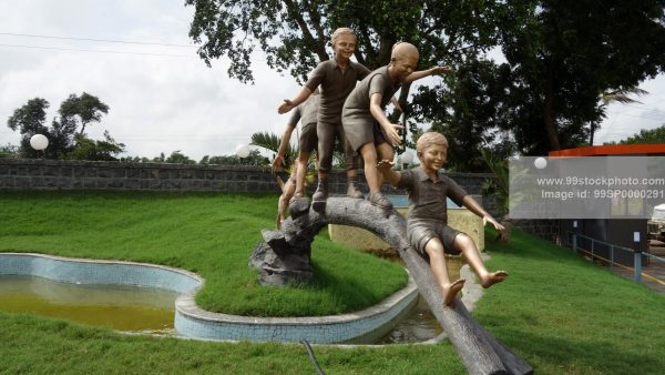 Stock Photo of Statue of Childrens Playing in Park