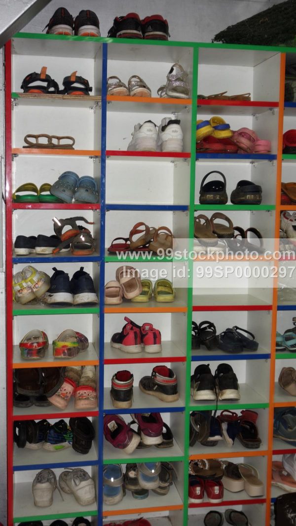 Stock Photo of Shoe Rack with Shoes and Slipons