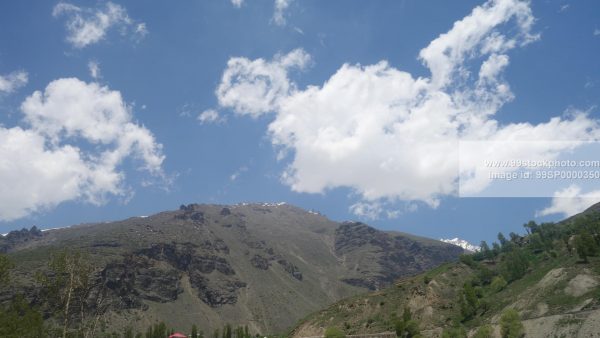 Stock Photo of Clouds Hills and Pine Trees