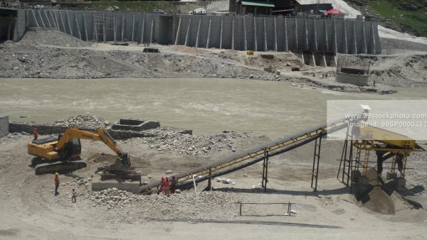 Stock Photo of Stone Crusher Poclain and Conveyor and Labour Type 1