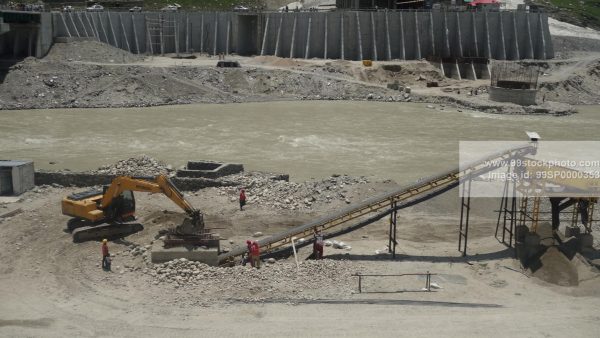 Stock Photo of Stone Crusher Poclain and Conveyor and Labour Type 2