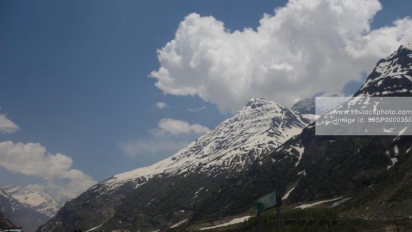 Stock Photo of Clouds Snow Hills and Pine Trees Type 5